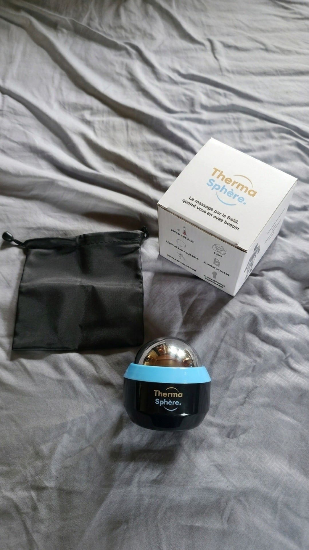 Avis client Thermasphère avec la balle de massage chaud froid, sa boîte et sa pochette de rangement Image